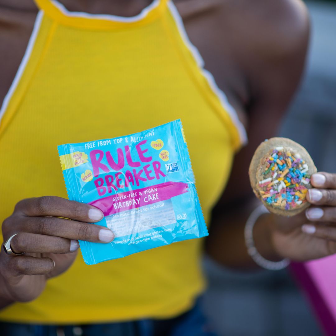 Rule Breaker Snacks Birthday Cake single in woman's hand