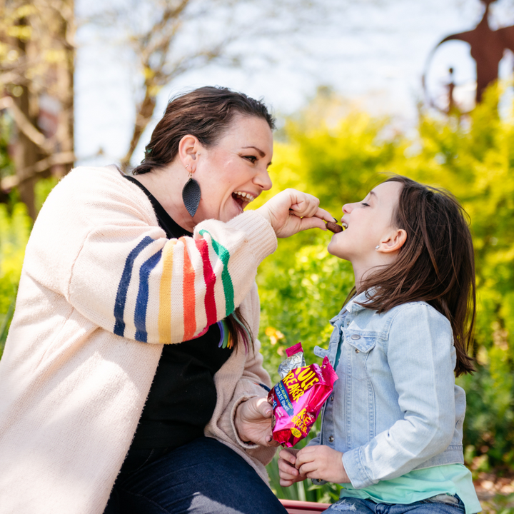 Mom and daughter enjoying Rule Breaker Snacks Brownie Bites