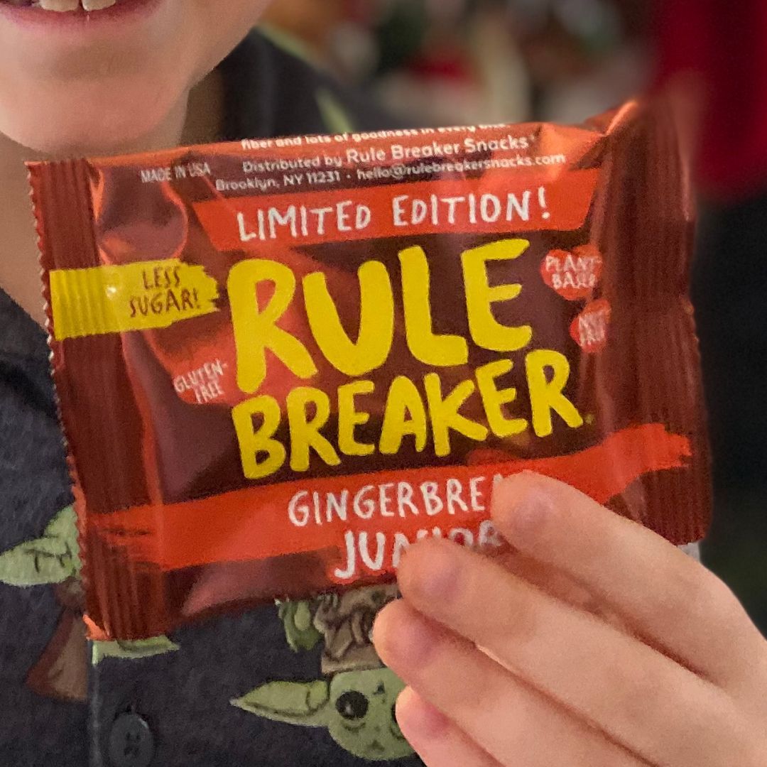 Kid holding Rule Breaker Snacks Gingerbread Junior