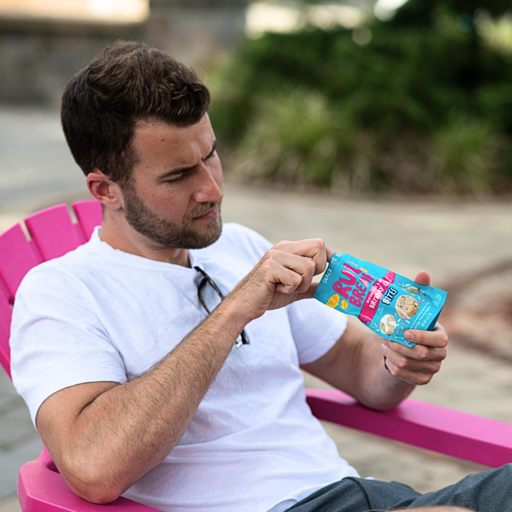 Rule Breaker Snacks man eating Birthday Cake Bites