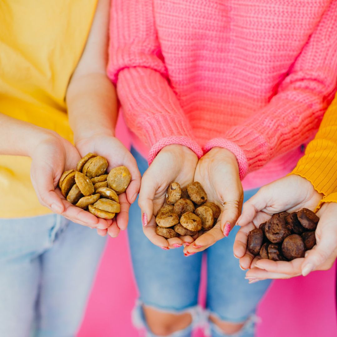 Women hands full of Rule Breaker Snacks Bites