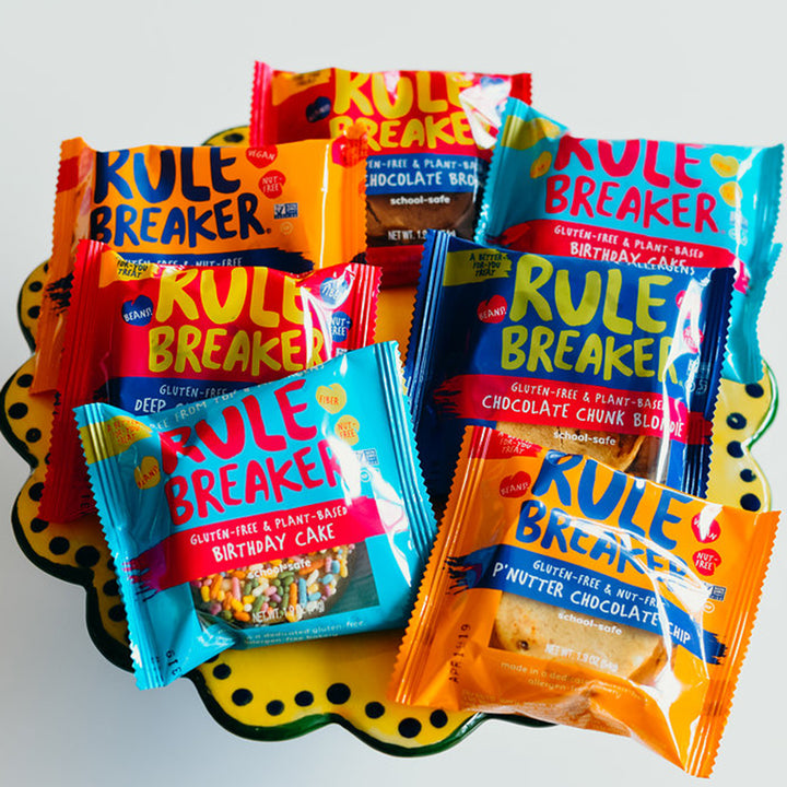 Four flavors of Rule Breaker Snacks singles, Brownie, Blondie, Birthday Cake, P'Nutter Chocolate Chip