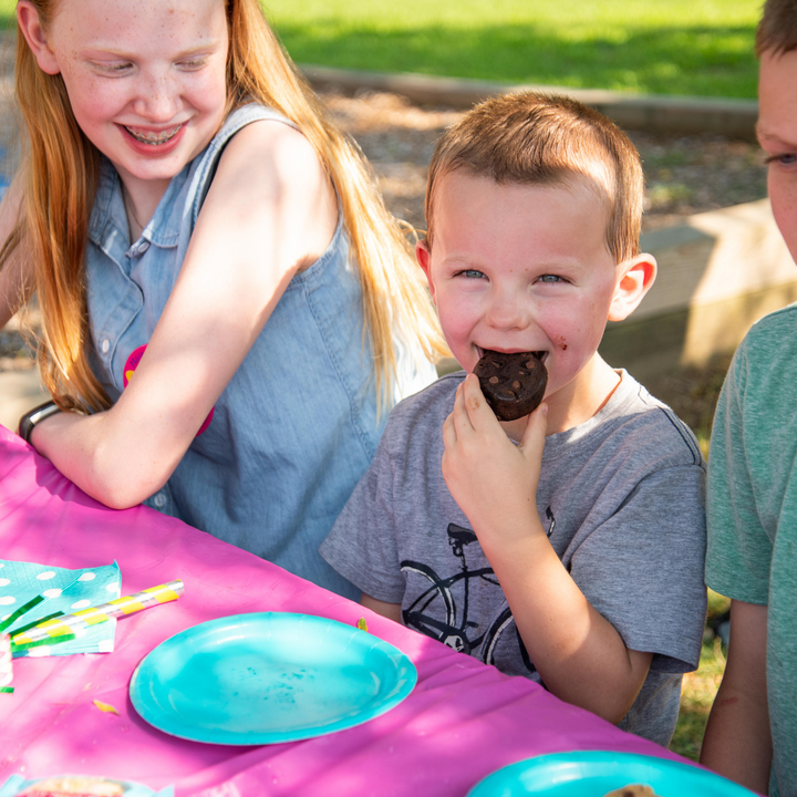 Little boy eating Rule Breaker brownie