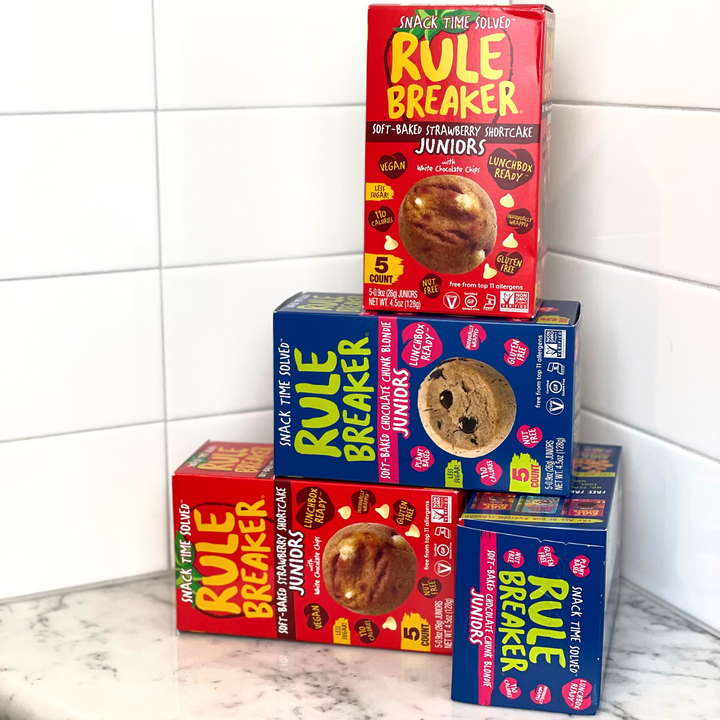 Rule Breaker Snacks Juniors stack of boxes of different flavors Blondie and Strawberry Shortcake