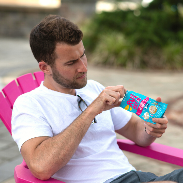 Rule Breaker Snacks man eating Birthday Cake Bites