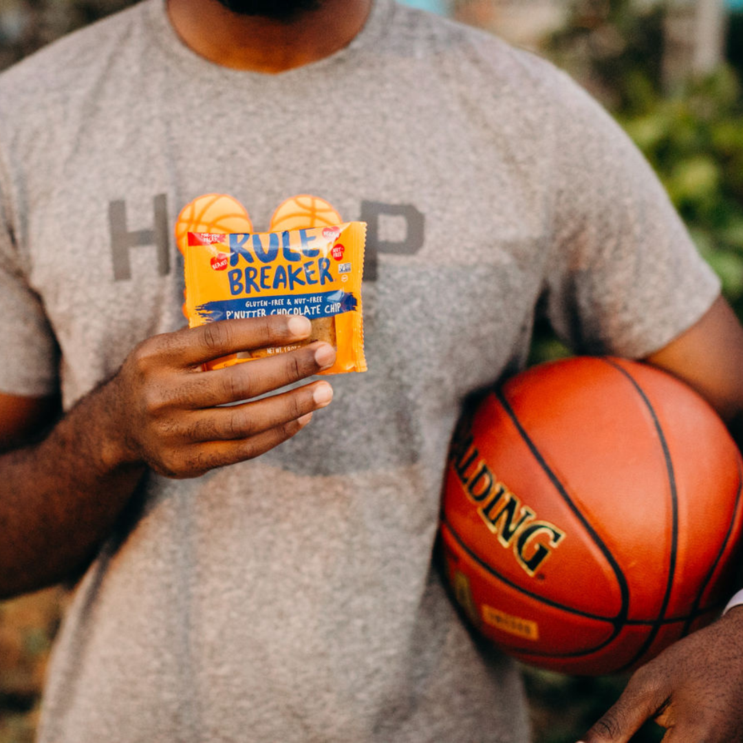 Man holding Rule Breaker Snacks p'nutter blondie