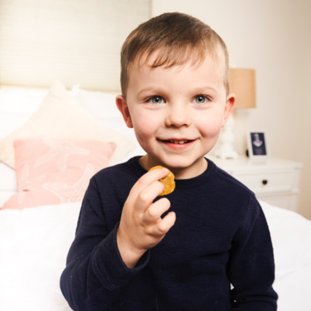 Little boy enjoying Rule Breaker Snacks Bites