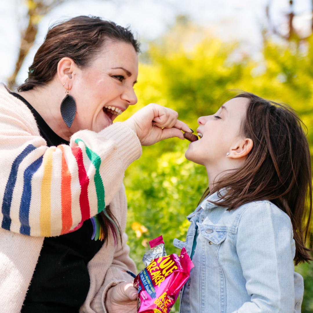 Rule Breaker Snacks Brownie Mom feeding child vegan gluten free allergen free snacks and smiling